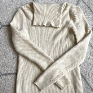 Cream colored cashmere turtle neck sweater from the 90s.
